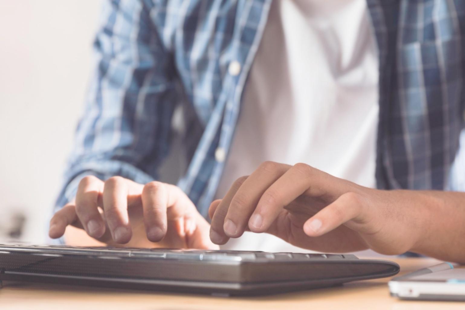 Person reviewing budget documents and receipts